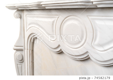 Carved patterns on stone luxury fireplace close up 74582179