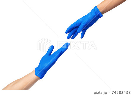 Male and female hands in medical gloves stretch to each other. Help concept. 74582438