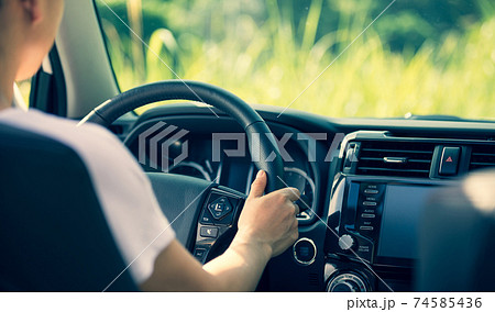 Asian woman driver driving off road car in the nature Asian woman driver driving off road car in the nature 74585436