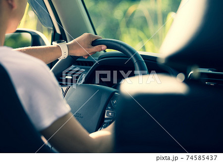 Asian woman driver driving off road car in the nature Asian woman driver driving off road car in the nature 74585437