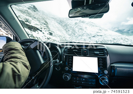 Driving off road car on snowing high altitude mountain trail on winter day Driving off road car on snowing high altitude mountain trail on winter day 74591523