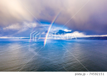 Aerial view of an rainbow above the Atlantic Ocean in Donegal - Ireland Aerial view of an rainbow above the Atlantic Ocean in Donegal - Ireland 74592151