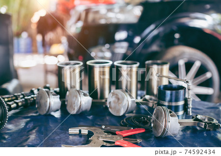 Auto mechanic working in garage. Repair service. 74592434