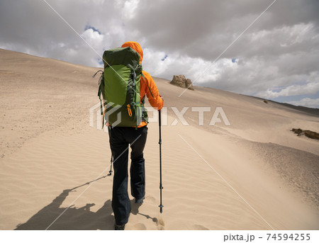 Backpacke solo hiking on desert 74594255