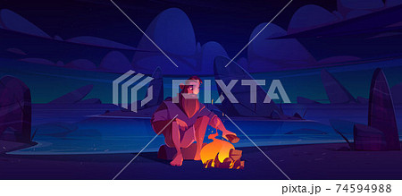 Castaway man on uninhabited island with bonfire 74594988