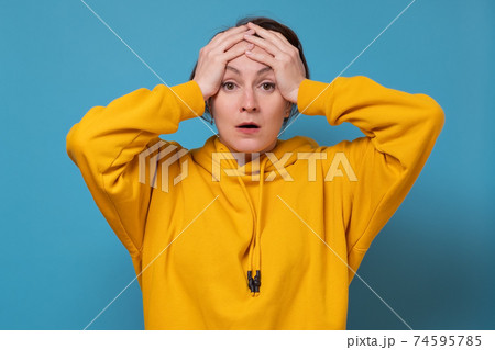 young woman being in panic holding hands on head. I forget to do important task. young woman being in panic holding hands on head. I forget to do important task. 74595785