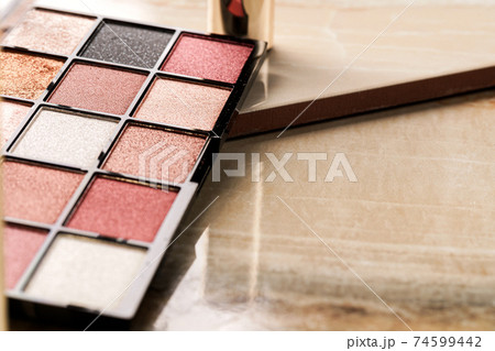 Close up of new matte eyeshadow colorful shades palette. Close up of new matte eyeshadow colorful shades palette. 74599442