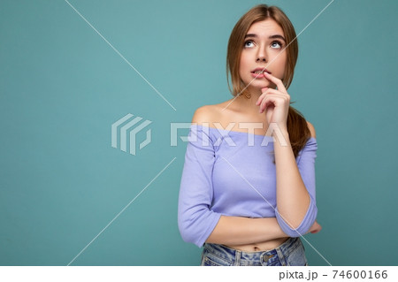Photo portrait of thoughtful young nice beautiful blonde lady with sincere emotions wearing trendy Photo portrait of thoughtful young nice beautiful blonde lady with sincere emotions wearing trendy 74600166