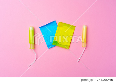 Female hygienic pad and tampons on pink background Female hygienic pad and tampons on pink background 74600246