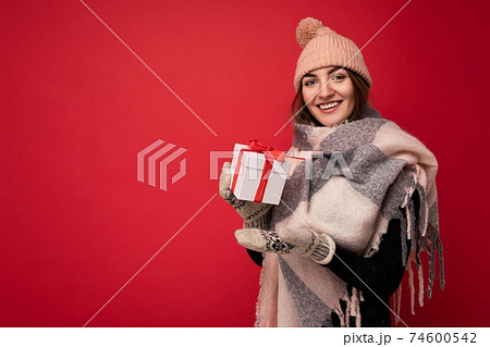 Beautiful happy young brunette woman isolated over colourful background wall wearing stylish casual Beautiful happy young brunette woman isolated over colourful background wall wearing stylish casual 74600542