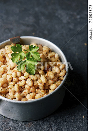 fried white beans in an old metallic container fried white beans in an old metallic container 74602378