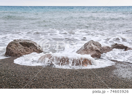 surf on a winter deserted sea beach surf on a winter deserted sea beach 74603926