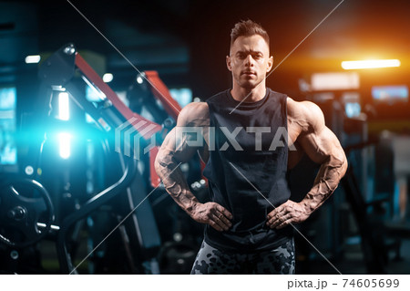 young sportsman bodybuilder with muscle body have workout in gym young sportsman bodybuilder with muscle body have workout in gym 74605699