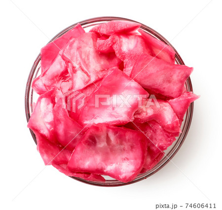 Pickled cabbage with slices of beets in a plate on a white background, isolated. Top view 74606411