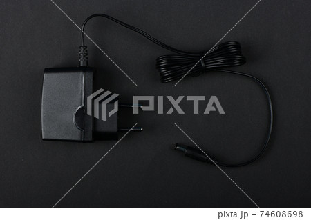 Black power ac to dc adaptor. 74608698