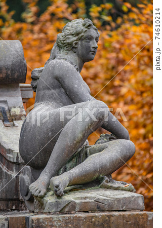 Statue of sensual Roman renaissance era woman after bathing, Potsdam, Germany, details, closeup Statue of sensual Roman renaissance era woman after bathing, Potsdam, Germany, details, closeup 74610214