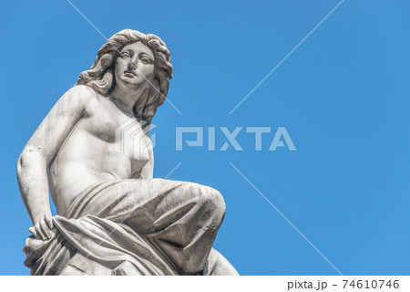 Beautiful topless girl as summit of State Opera fountain in Vienna in front of blue sky, Austria, details, closeup Beautiful topless girl as summit of State Opera fountain in Vienna in front of blue sky, Austria, details, closeup 74610746