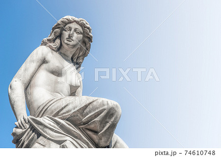 Beautiful topless girl as summit of State Opera fountain in Vienna in front of blue sky, Austria, details, closeup Beautiful topless girl as summit of State Opera fountain in Vienna in front of blue sky, Austria, details, closeup 74610748