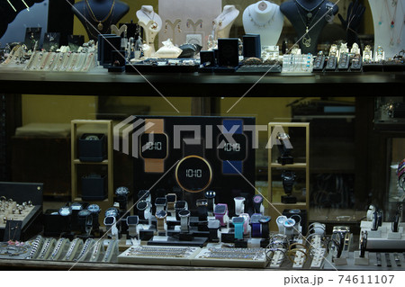 Collection of necklaces and earrings at jewelry store. 74611107