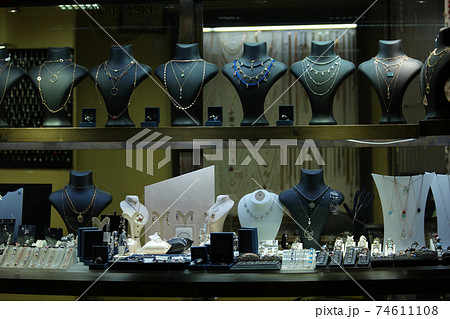 Variety of necklaces and earrings on mannequins at jewelry store. Variety of necklaces and earrings on mannequins at jewelry store. 74611108