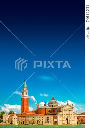 Beautiful Church of San Giorgio Maggiore and its Bell Tower at sunset illumination, Venice, Italy, summer 74611231