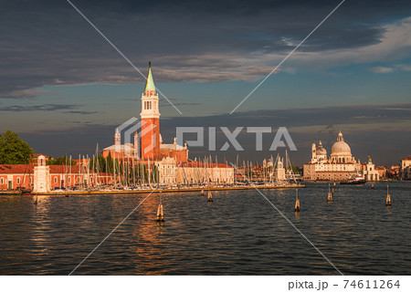 Beautiful Church of San Giorgio Maggiore and its Bell Tower at sunset illumination, Venice, Italy, summer 74611264