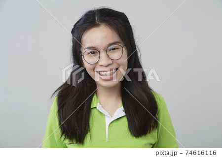 Asian woman portrait with a green shirt 74616116