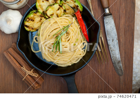 italian spaghetti pasta with zucchini sauce on iron skillet italian spaghetti pasta with zucchini sauce on iron skillet 74620471