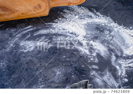 Rolling pin and kitchenware for making easter cookies on dark background Rolling pin and kitchenware for making easter cookies on dark background 74623809