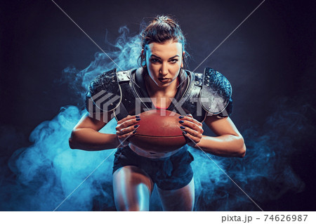 Sportive woman with rugby ball Sportive woman with rugby ball 74626987