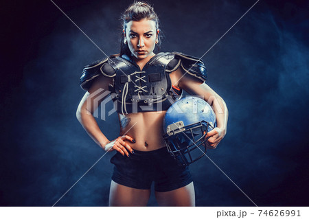 Young brunette wearing sexy uniform of rugby football player posing Young brunette wearing sexy uniform of rugby football player posing 74626991