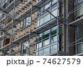 Renovation apartment building exterior with scaffolding.Winter morning.Telsiai,Lithuania 02.11.2021 74627579