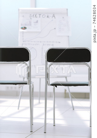 row of chairs in the conference room. 74628034