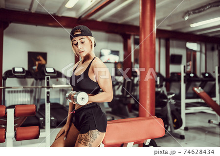 Fit girl exercise in gym. Fit girl exercise in gym. 74628434