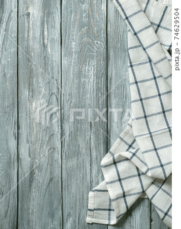 Gray wooden table with kitchen napkin, flat lay 74629504