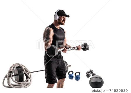 Aggressive bearded strong muscular Man in sportswear and headpho 74629680