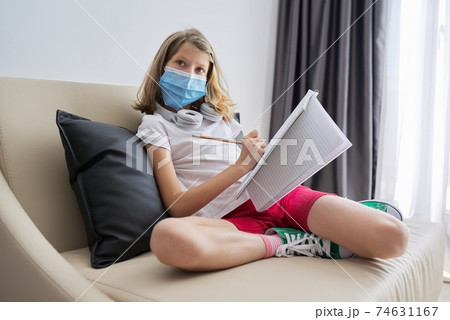 Girl child student in protective medical mask on her face 74631167