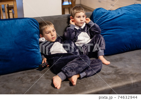 the little brothers in kigurumi watching tv at home the little brothers in kigurumi watching tv at home 74632944