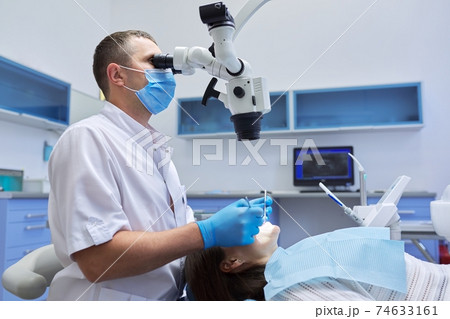 Healthcare dentistry medicine, male doctor dentist treating teeth 74633161