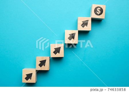 Us dollar growth concept and with icons on wooden blocks. Us dollar growth concept and with icons on wooden blocks. 74633858