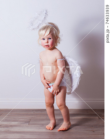 the baby with angel wings and nimbus indoors the baby with angel wings and nimbus indoors 74633939
