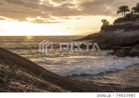 Calm Atlantic at small Tenerife bay at dusk 74633985