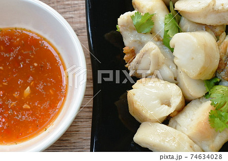 fried squid egg or gonad with chop fresh cabbage on plate dipping spicy and sour sauce fried squid egg or gonad with chop fresh cabbage on plate dipping spicy and sour sauce 74634028