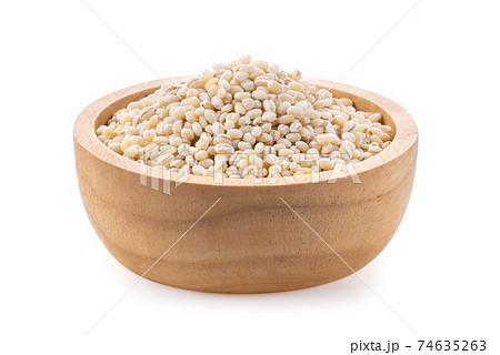 pile of pearl barley in wood bowl on white background pile of pearl barley in wood bowl on white background 74635263