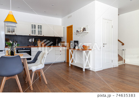 Modern design interior of dining room, kitchen, white furniture 74635383