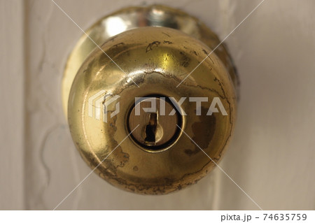 A keyhole of a door. A keyhole of a door. 74635759