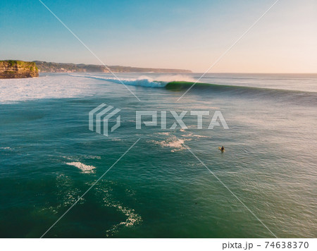 Aerial view of big wave with evening light. Biggest ocean waves in Bali Aerial view of big wave with evening light. Biggest ocean waves in Bali 74638370