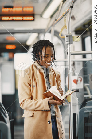 Young African businessman standing on a bus 74639691