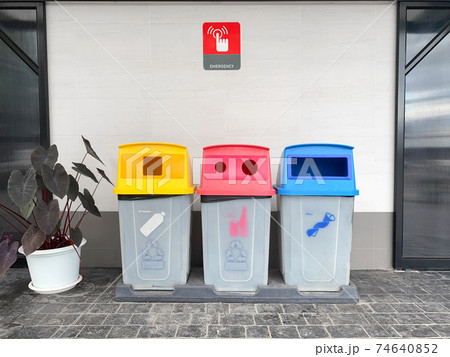 Trash in garbage cans with sorted garbage. Recycling garbage separation collection and recycled in the park Trash in garbage cans with sorted garbage. Recycling garbage separation collection and recycled in the park 74640852