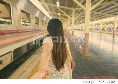 Young beautiful Asian tourist woman at the railway station in Bangkok, Thailand Young beautiful Asian tourist woman at the railway station in Bangkok, Thailand 74641202